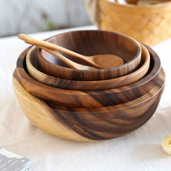 Handcrafted artisan wooden salad bowl and organic dough basin for sustainable kitchen decor and natural meal prep.