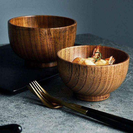 Handcrafted artisan wooden salad bowl and organic dough basin for sustainable kitchen decor and natural meal prep.