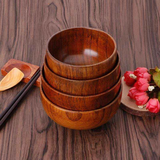 Handcrafted artisan wooden salad bowl and organic dough basin for sustainable kitchen decor and natural meal prep.