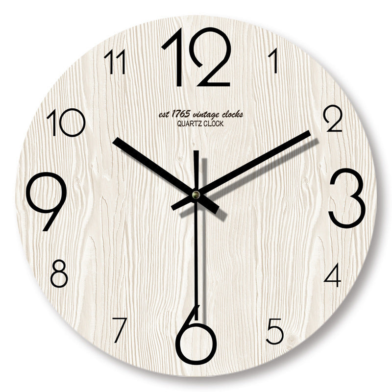 Handcrafted wooden wall clock by WoodyKitchenware featuring a 12-inch solid wood design with black clock hands.