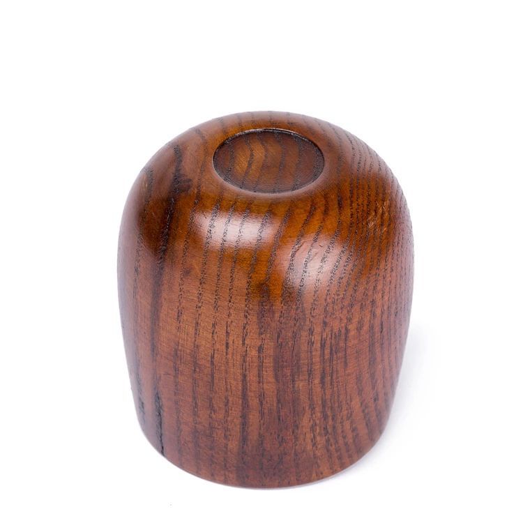 Hand-carved wooden kuksa mug from WoodyKitchenware, featuring intricate artisan craftsmanship and natural wood grain.