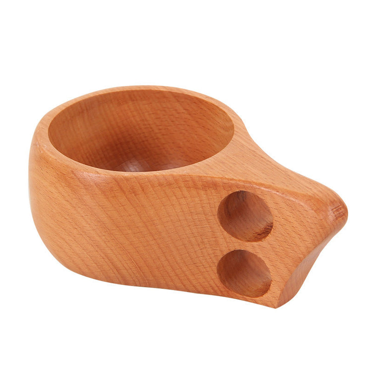 Hand-carved beechwood Kuksa cup from WoodyKitchenware, featuring a single-hole handle and natural wood grain.