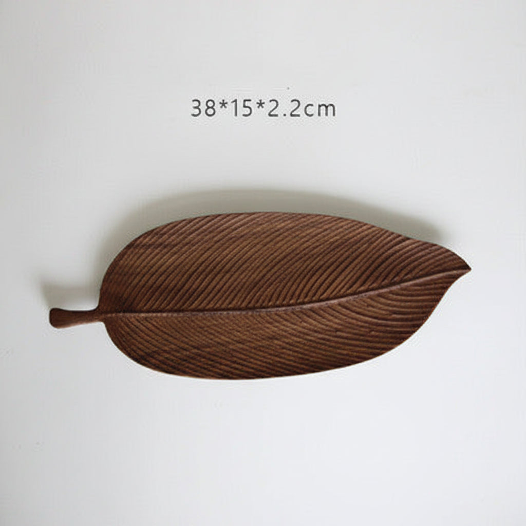 Small handmade wooden tray by WoodyKitchenware, featuring a glossy beechwood surface with forest sculpture design for serving or display.