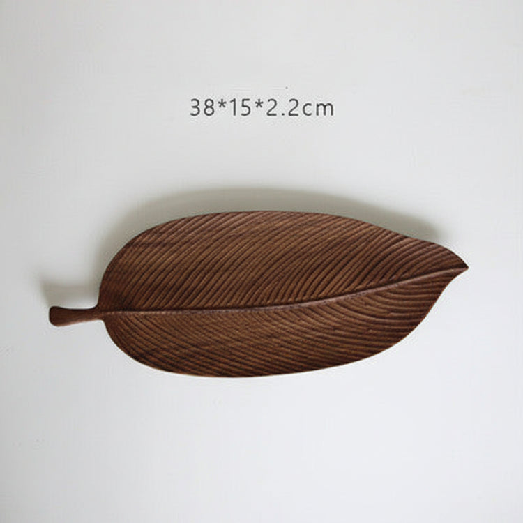 Small handmade wooden tray by WoodyKitchenware, featuring a glossy beechwood surface with forest sculpture design for serving or display.