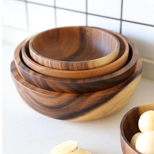 Natural wooden bowl by WoodyKitchenware, showcasing smooth brown finish and versatile size for kitchen and dining use.