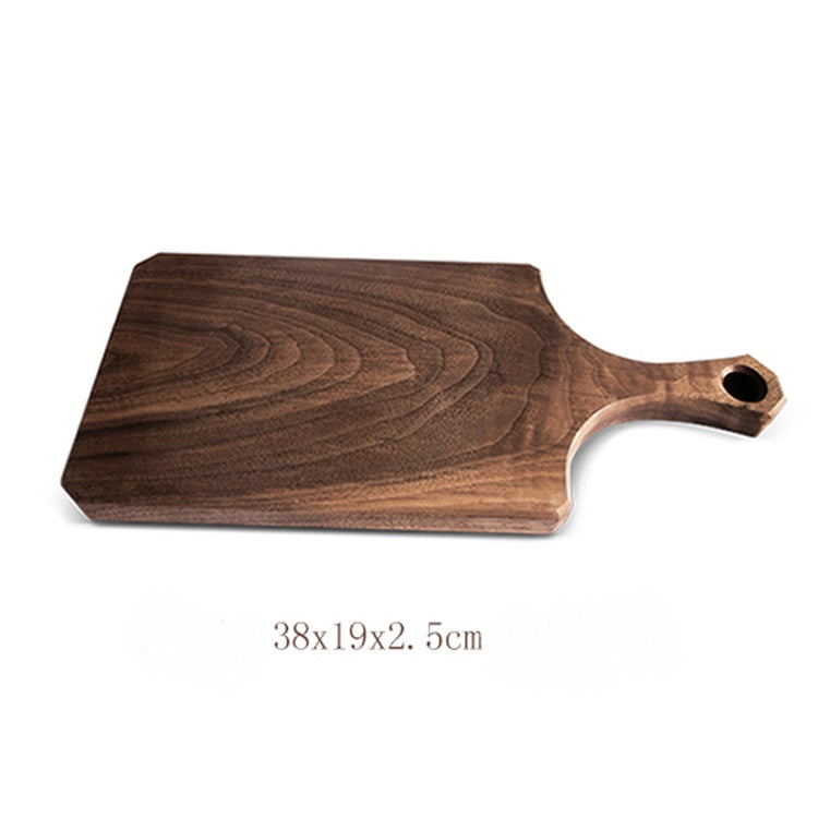 Raw black walnut log breadboard by WoodyKitchenware featuring rustic, natural wood texture for timeless kitchen use.