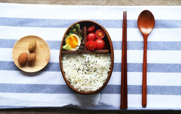 Round brown wooden bento box by WoodyKitchenware, traditional Japanese lunch box with smooth wood finish and compact design.