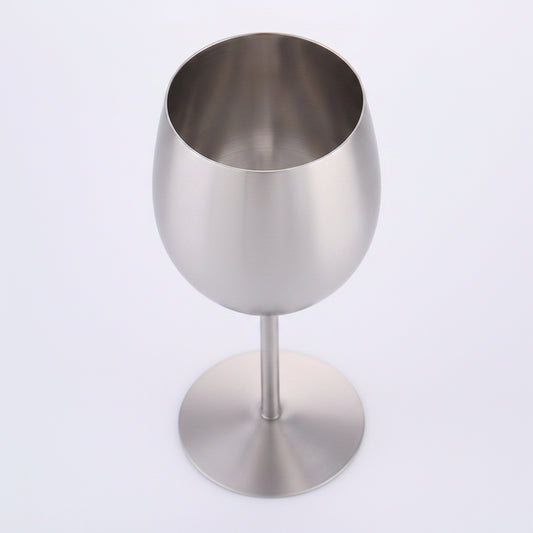 Artisan stainless steel chalice called The Sovereign Stem by WoodyKitchenware, featuring a sleek, polished design on a plain background.