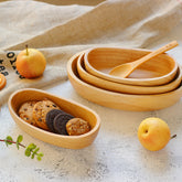 Handcrafted artisan wooden salad bowl and organic dough basin for sustainable kitchen decor and natural meal prep.