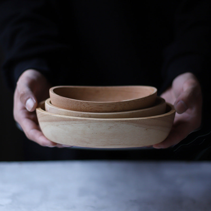 Handcrafted artisan wooden salad bowl and organic dough basin for sustainable kitchen decor and natural meal prep.