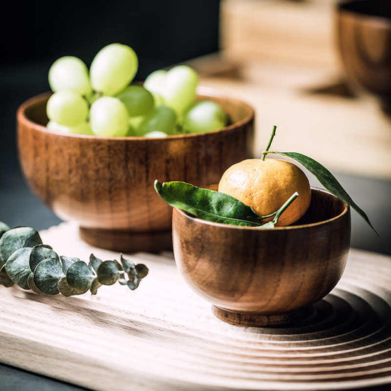 Handcrafted artisan wooden salad bowl and organic dough basin for sustainable kitchen decor and natural meal prep.