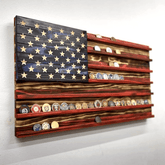 Wooden American flag wall art with embroidered patches on a white background