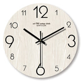 Handcrafted wooden wall clock by WoodyKitchenware featuring a 12-inch solid wood design with black clock hands.