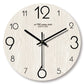 Handcrafted wooden wall clock by WoodyKitchenware featuring a 12-inch solid wood design with black clock hands.