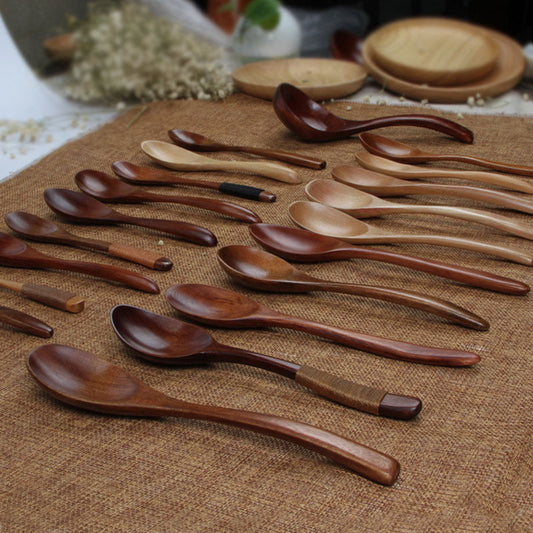 Japanese solid wood honey spoon by WoodyKitchenware featuring a sleek, functional design for easy honey serving.