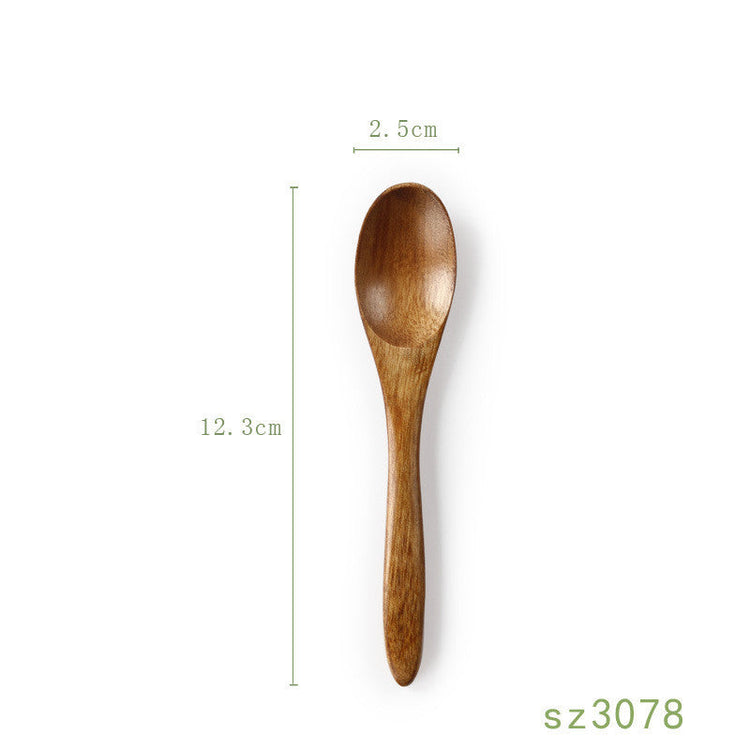 Japanese solid wood honey spoon from WoodyKitchenware, featuring a sleek, elegant design and functional shape for honey serving.