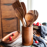 Set of 10 wooden cooking spatulas by WoodyKitchenware, including various solid timber spatulas for professional kitchen use.