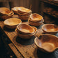 Handcrafted solid wood fruit and salad bowl with a unique cedar root design by WoodyKitchenware, showcasing natural wood grain and craftsmanship.