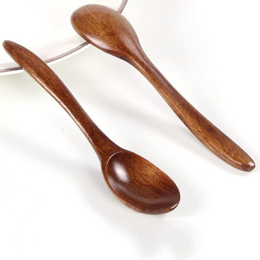Set of five wooden cooking spoons by WoodyKitchenware, sustainable and stylish kitchen utensils for cooking and stirring.