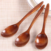Set of five wooden cooking spoons from WoodyKitchenware, sustainable and stylish kitchen utensils for versatile cooking.
