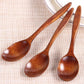 Set of five wooden cooking spoons from WoodyKitchenware, sustainable and stylish kitchen utensils for versatile cooking.
