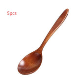 Set of five wooden cooking spoons from WoodyKitchenware, sustainable and stylish kitchen essentials for cooking and stirring.