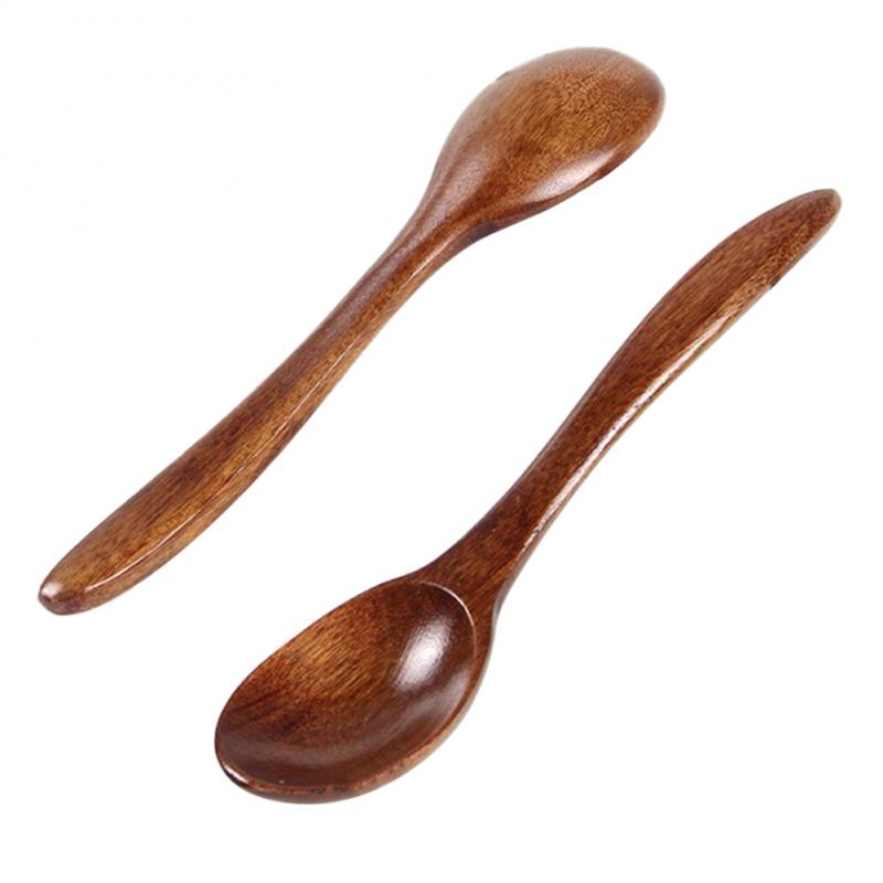 Set of five wooden cooking spoons by WoodyKitchenware, sustainable and stylish kitchen essential for cooking and serving.