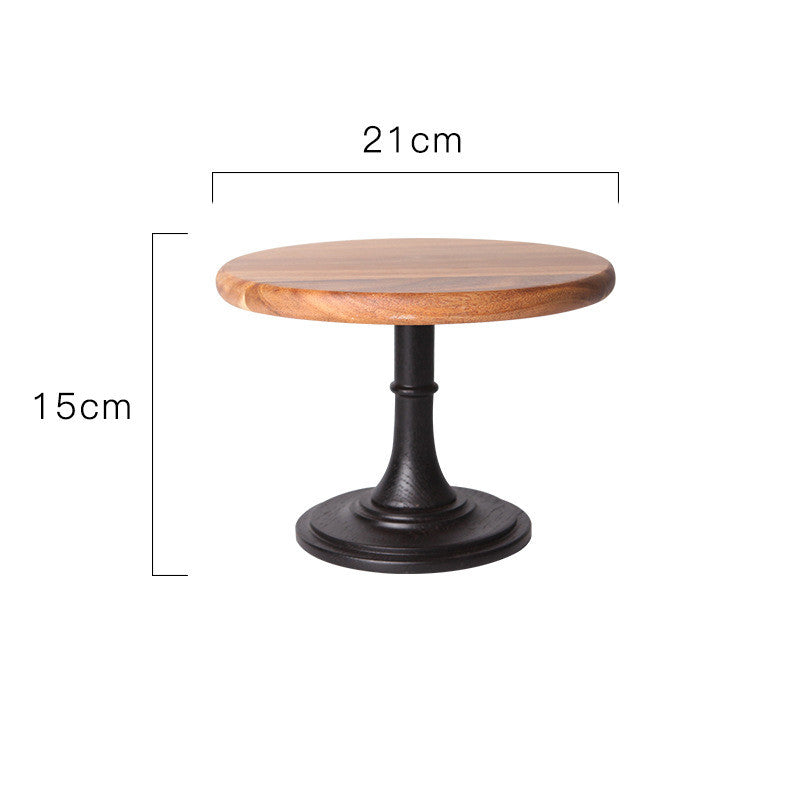 Wooden cake stand by WoodyKitchenware made of solid acacia with a 21cm pedestal for elegant dessert presentation.