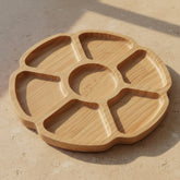 Wooden dividing tray by WoodyKitchenware featuring irregular circular sections, perfect for serving dim sum or fruit.