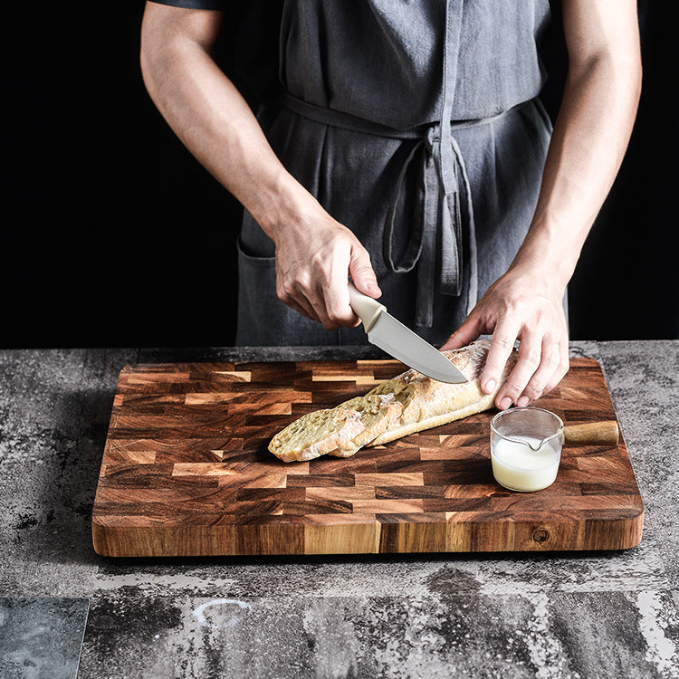 Acacia chopping board by WoodyKitchenware, wooden kitchen accessory with a smooth surface and sturdy build for food prep.