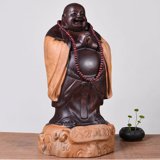 Wooden Buddha statue by WoodyKitchenware, ebony laughing guardian sculpture crafted from solid timber, 30cm tall.