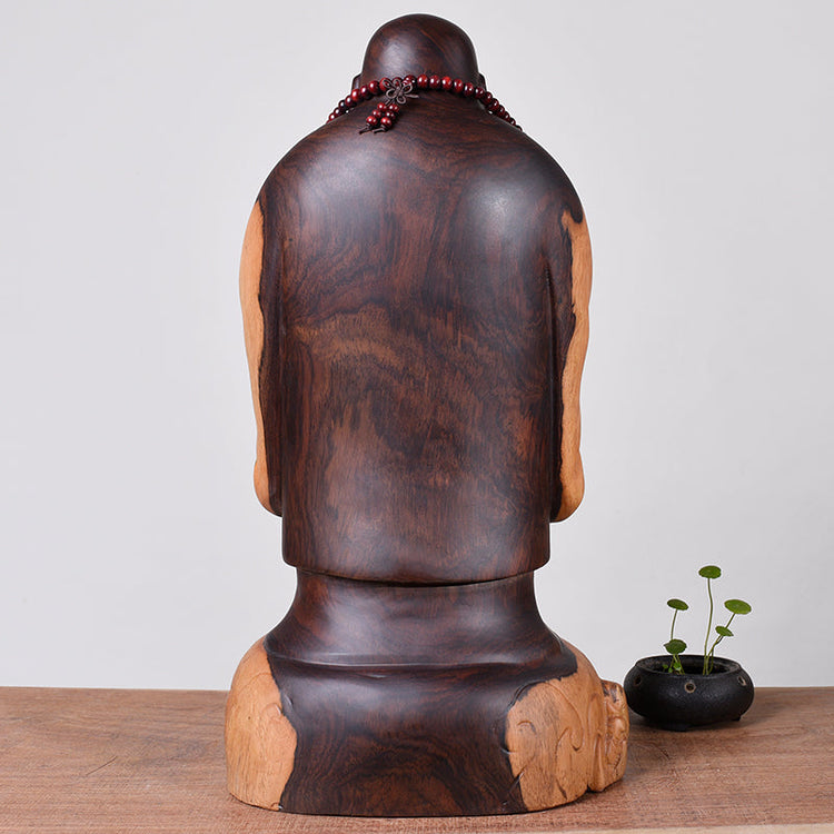 Wooden Buddha statue by WoodyKitchenware, ebony laughing guardian solid timber sculpture, displayed with intricate carved details.