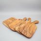 Irregular solid olive wood cutting board by WoodyKitchenware, Mediterranean Shield design, natural wood grain, 30x15cm kitchen accessory.