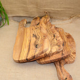 Olive wood cutting board by WoodyKitchenware, irregular-shaped Mediterranean Shield solid timber, perfect for kitchen prep or serving.