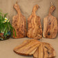 Olive wood cutting board by WoodyKitchenware with irregular shape, showing its natural grain and Mediterranean-inspired design.