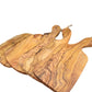 Olive wood cutting board by WoodyKitchenware with irregular edges, perfect for kitchen prep and serving.