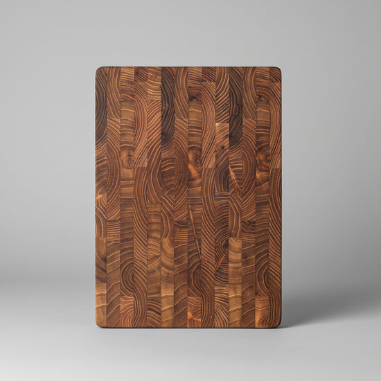 Square solid teak chopping board by WoodyKitchenware, featuring a smooth surface and natural wood grain for everyday kitchen use.