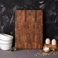 Square solid teak chopping board by WoodyKitchenware, featuring a smooth surface and natural wood grain for everyday kitchen use.