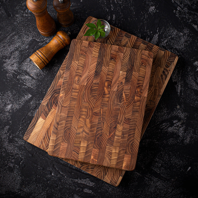 Square solid wood chopping board made of premium teak with smooth surface, ideal for everyday food prep by WoodyKitchenware.