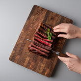 Square solid teak chopping board by WoodyKitchenware, 34x24x2.5cm, featuring smooth surface and natural wood grain for everyday use.