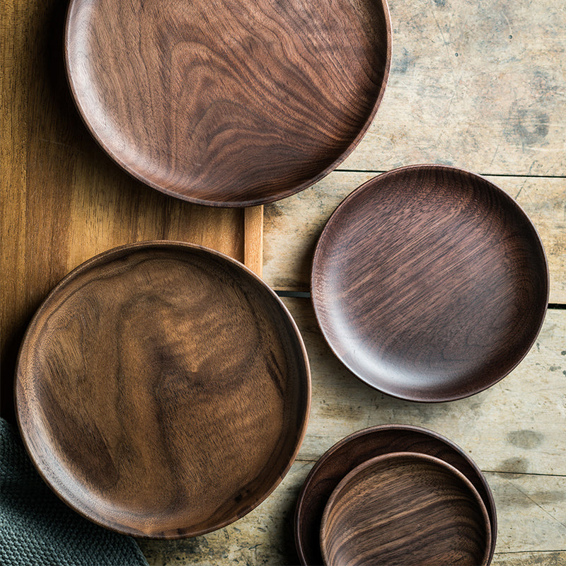 Black Walnut round dish by WoodyKitchenware, elegant serving tray for dried fruits and desserts, showcasing natural wood grain.