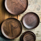 Black Walnut round dish by WoodyKitchenware, elegant serving tray for dried fruits and desserts, showcasing natural wood grain.