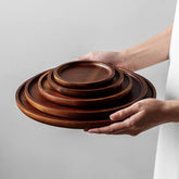 Elegant round wooden Japanese storage cake tray by WoodyKitchenware, showcasing a smooth circular wooden cake stand.
