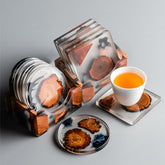Resin pine coaster set by WoodyKitchenware featuring heat-resistant teacup mats for protecting surfaces.