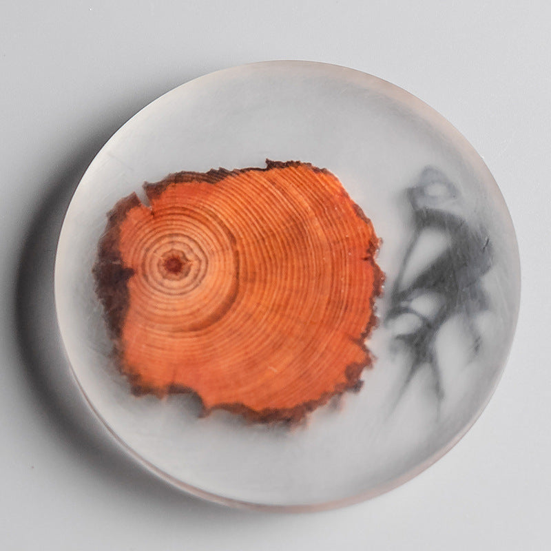 Round resin pine coaster by WoodyKitchenware, heat-resistant teacup mat for protecting surfaces from hot beverages.