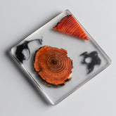 Round resin pine coaster by WoodyKitchenware, heat-resistant teacup mat for protecting surfaces from hot beverages.