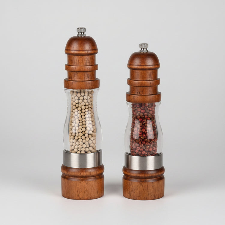 Wooden salt and pepper grinder duo by WoodyKitchenware with solid timber design, placed on a kitchen countertop.