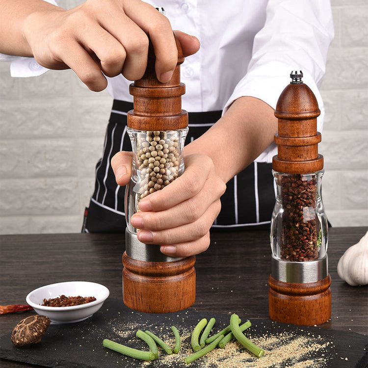Wooden salt and pepper grinder set by WoodyKitchenware, featuring solid timber mills with a natural finish for seasoning.