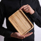 Rectangular bamboo wooden dinner tray by WoodyKitchenware, showing a natural finish and sturdy handles for household use.