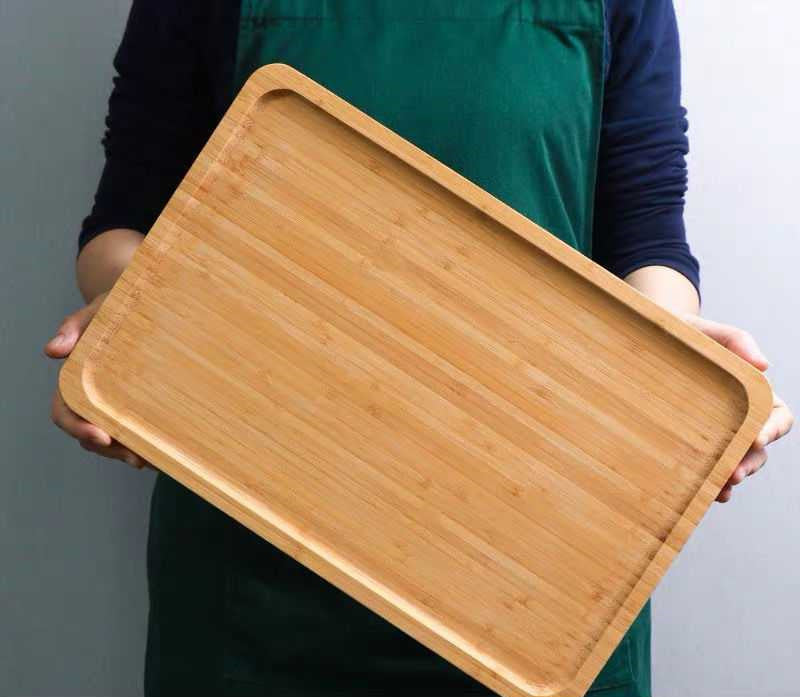 Rectangular bamboo wooden dinner plate tray by WoodyKitchenware, ideal for household serving and food presentation.